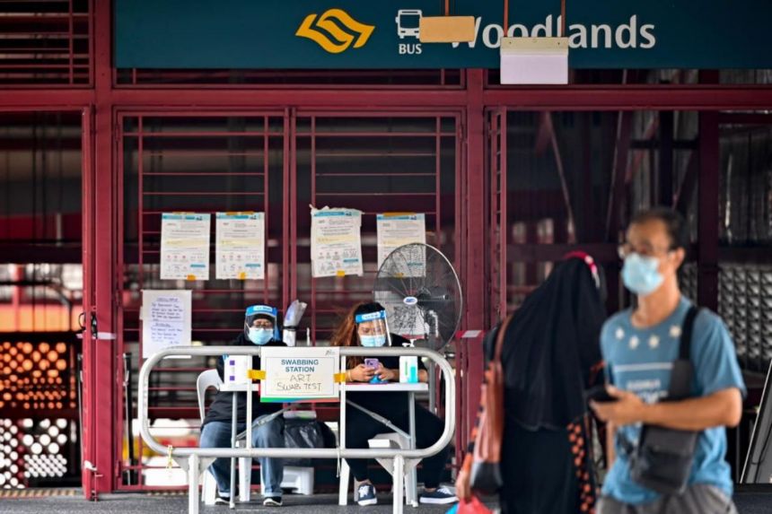 An antigen rapid test station at the entrance of the Woodlands Temporary Bus Interchange on Nov 28, 2021. (Photo / Provided by The Straits Times, LIM YAOHUI)