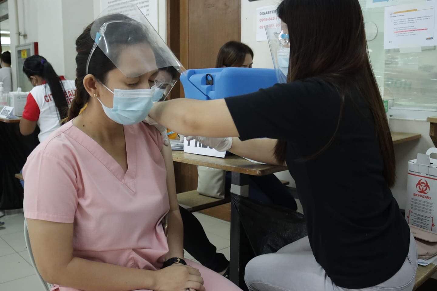 A medical worker of the Rafael Lazatin Memorial Medical Center in Angeles City gets her booster shot against COVID-19. (Photo / Provided by the Philippine Daily Inquirer, the Angeles City government)