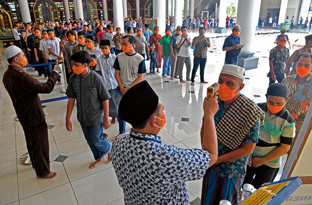 Kasus Terinfeksi COVID-19 di Indonesia Melonjak Drastis, Varian Virus Delta Merajalela di Jawa Tengah. Sumber: foto diambil dari European Pressphoto Agency. 