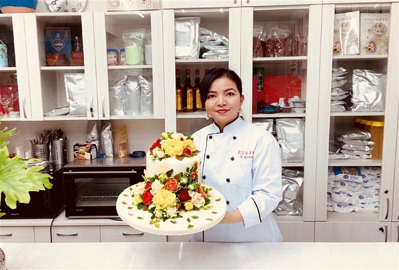 Di dân mới người Việt Nam Biện Thị Kim Ngọc đoạt thành tích xuất sắc tại Lễ hội Ẩm thực và du lịch Bỉ năm 2021. (Ảnh:《聯合報》)