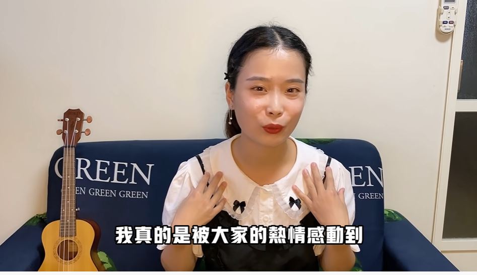 Di dân mới người Trung Quốc quay video chia sẻ kinh nghiệm của bản thân về phiếu tiêu dùng trị giá gấp 5 lần với di dân mới. (Nguồn ảnh: kênh Youtube “胡辣湯姐姐在台灣”)