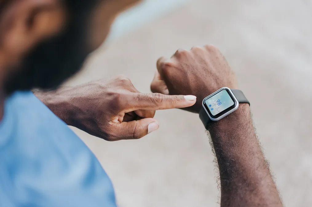 A smartwatch with a heart rate monitor can help athletes track their heart rates to keep them in a certain range.  andreswd/E+/Getty Images