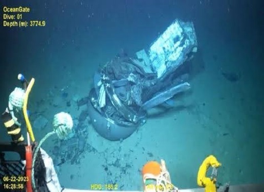 A video still frame shows the remains of the Titan submersible, center, on the floor of the Atlantic Ocean.  Pelagic Research Services/US Coast Guard/AP