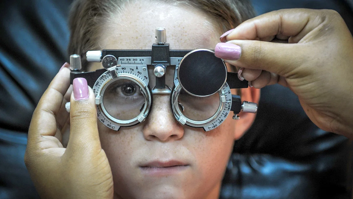 An optometrist testing a child's vision  Yamil Lage/AFP/Getty Images