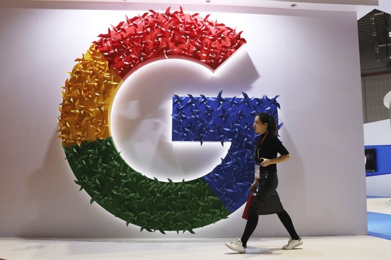 (Google sign at an international import expo in Shanghai (AP))