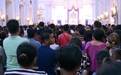 Filipino Catholics attending mass. Photograph: PNA