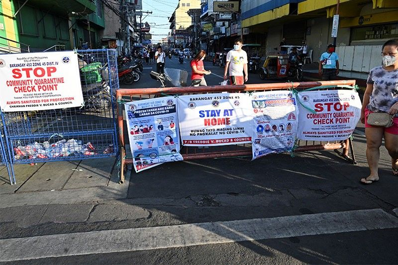 Manila Mayor Isko Moreno has placed under granular lockdown at least 29 barangays in the city amid a surge in COVID-19 cases. Image courtesy of philstar GLOBAL, AFP/Ted Aljibe